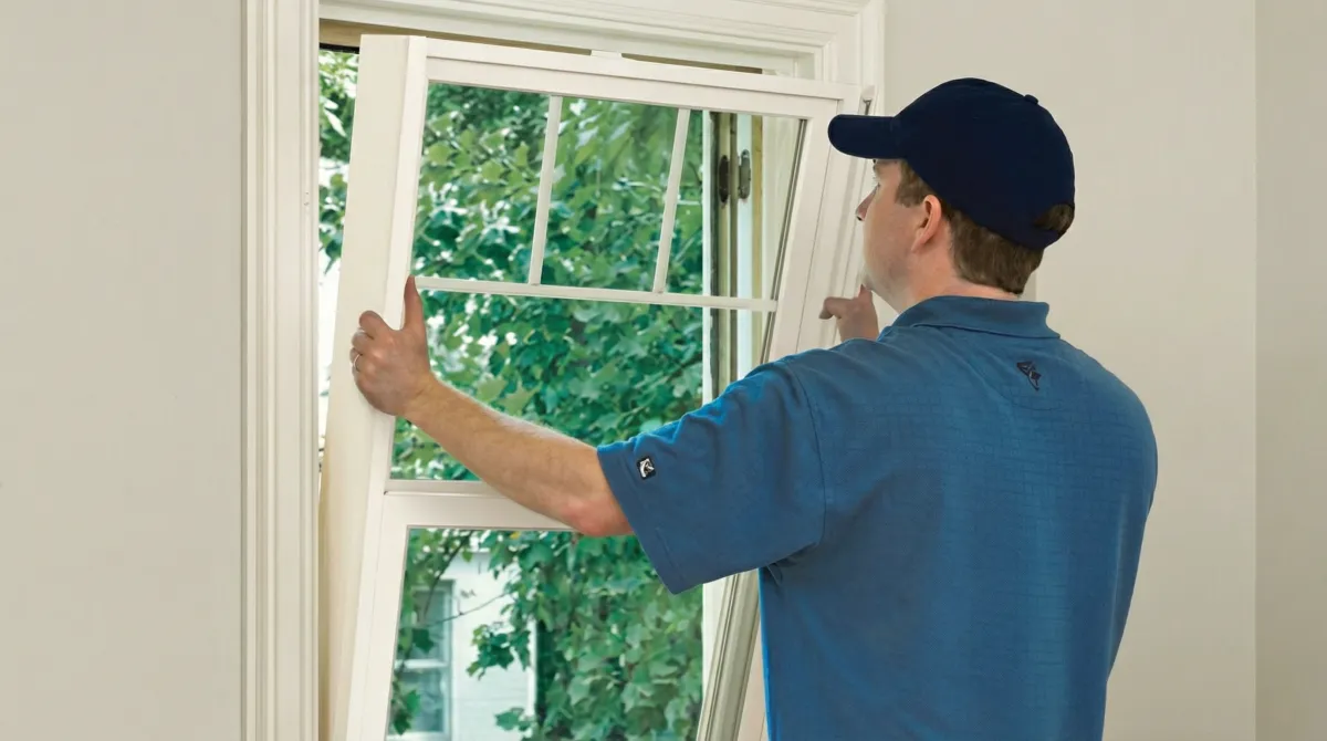 Professional contractors performing a residential window insulation and replacement service in Chattanooga, TN
